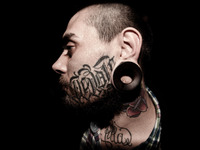 Portraits of tattooed people, in Milan, Italy. (