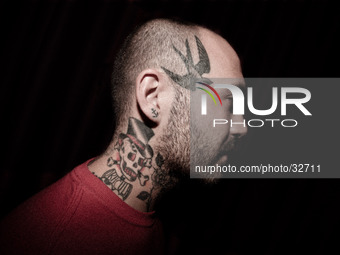 Portraits of tattooed people, in Milan, Italy. (