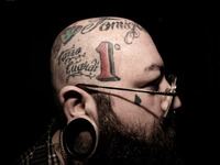 Portraits of tattooed people, in Milan, Italy. (