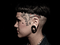 Portraits of tattooed people, in Milan, Italy. (