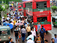 Bangladeshi Passengers gathers side the road to get on the public bus on the first day of 48-hour countrywide transport strike in Dhaka, Ban...