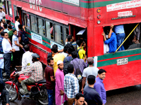 Bangladeshi Passengers gathers side the road to get on the public bus on the first day of 48-hour countrywide transport strike in Dhaka, Ban...