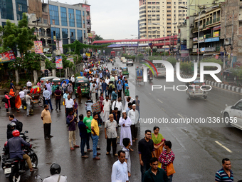 Bangladeshi Passengers waits for public buses near the roads on the first day of 48-hour countrywide transport strike in Dhaka, Bangladesh,...