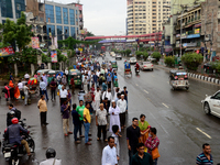 Bangladeshi Passengers waits for public buses near the roads on the first day of 48-hour countrywide transport strike in Dhaka, Bangladesh,...