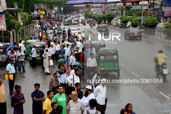 Bangladeshi Passengers waits for public buses near the roads on the first day of 48-hour countrywide transport strike in Dhaka, Bangladesh,...