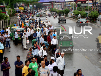 Bangladeshi Passengers waits for public buses near the roads on the first day of 48-hour countrywide transport strike in Dhaka, Bangladesh,...