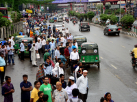 Bangladeshi Passengers waits for public buses near the roads on the first day of 48-hour countrywide transport strike in Dhaka, Bangladesh,...