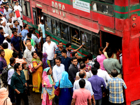 Bangladeshi Passengers gathers side the road to get on the public bus on the first day of 48-hour countrywide transport strike in Dhaka, Ban...