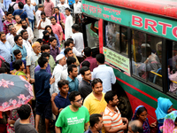 Bangladeshi Passengers gathers side the road to get on the public bus on the first day of 48-hour countrywide transport strike in Dhaka, Ban...