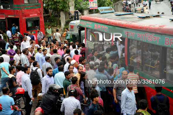 Bangladeshi Passengers gathers side the road to get on the public bus on the first day of 48-hour countrywide transport strike in Dhaka, Ban...