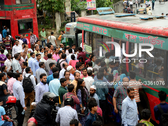 Bangladeshi Passengers gathers side the road to get on the public bus on the first day of 48-hour countrywide transport strike in Dhaka, Ban...