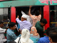 Bangladeshi Passengers gathers side the road to get on the public bus on the first day of 48-hour countrywide transport strike in Dhaka, Ban...