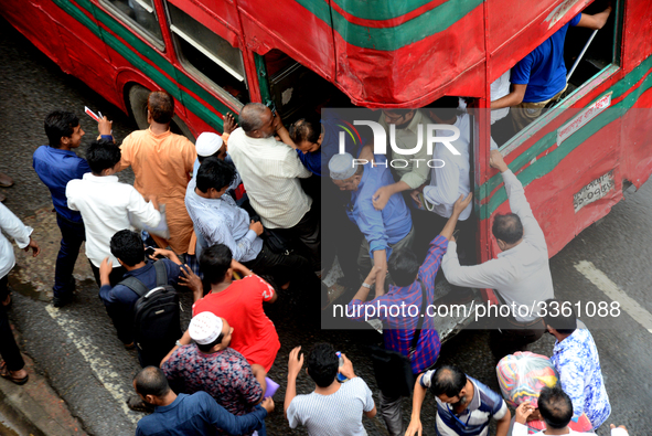 Bangladeshi Passengers gathers side the road to get on the public bus on the first day of 48-hour countrywide transport strike in Dhaka, Ban...