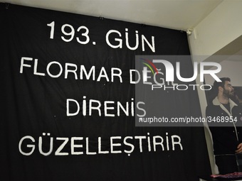 A man stands next to a banner during a solidarity event in support of Flormar's workers in Ankara, Turkey on November 23, 2018. The resistan...