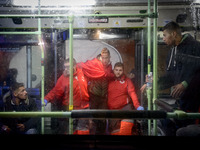 a migrant being helped by the red cross staffs to get inside of the bus to be transferred to a center. 22-11-2018, Malaga. The Spaniard Mari...