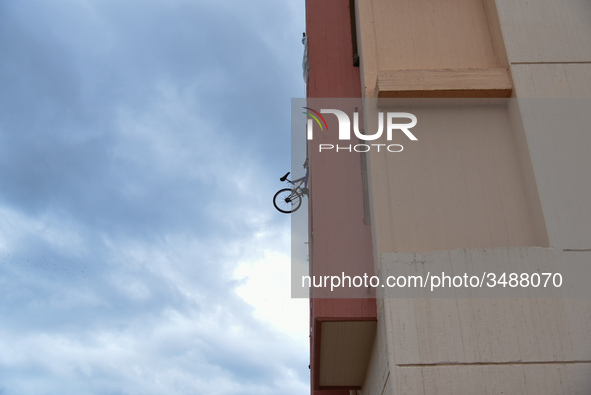 The balconies are very small - so the students are hanging chairs and bicycles outside the building