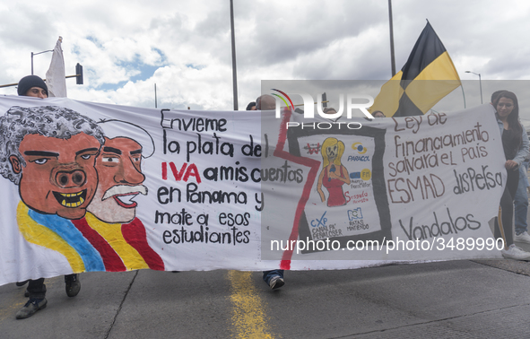 People hold a poster on the march of students for public education in Bogota, Colombia, on 28 November 2018. 