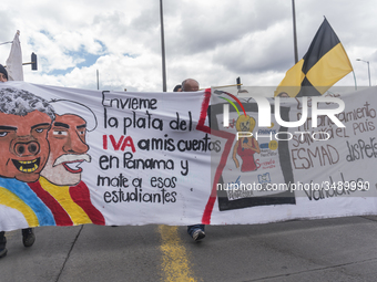 People hold a poster on the march of students for public education in Bogota, Colombia, on 28 November 2018. (