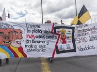 People hold a poster on the march of students for public education in Bogota, Colombia, on 28 November 2018. (