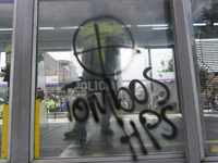 Graffiti at the doors of public transportation in the march of students for public education in Bogota, Colombia, on 28 November 2018. (