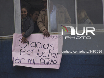 People hold a poster on the march of students for public education in Bogota, Colombia, on 28 November 2018.

 (