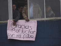 People hold a poster on the march of students for public education in Bogota, Colombia, on 28 November 2018.

 (