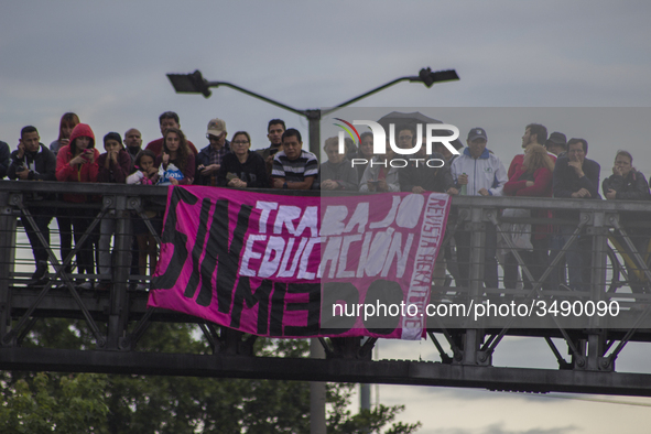 People hold a poster on the march of students for public education in Bogota, Colombia, on 28 November 2018.

 