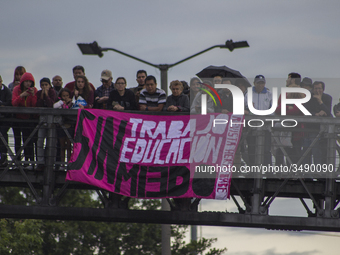 People hold a poster on the march of students for public education in Bogota, Colombia, on 28 November 2018.

 (