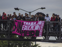 People hold a poster on the march of students for public education in Bogota, Colombia, on 28 November 2018.

 (