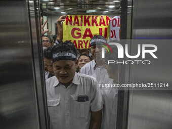 Jakarta, Indonesia, 04 December 2018 : Employee of Antara News Agency using elevator to the floor where they held the demonstration, which t...