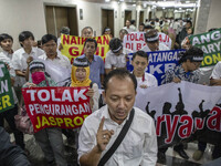 Jakarta, Indonesia, 04 December 2018 : GOFUR the coordinator of the demonstration from ANTARA Labour Organization giving press conference du...