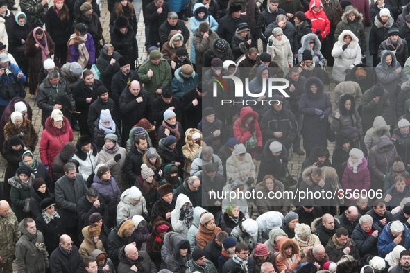 KIEV, UKRAINE - NOVEMBER 30: People make the sign of the Cross during the prayer for peace headed by The head of the Ukrainian Orthodox Chur...