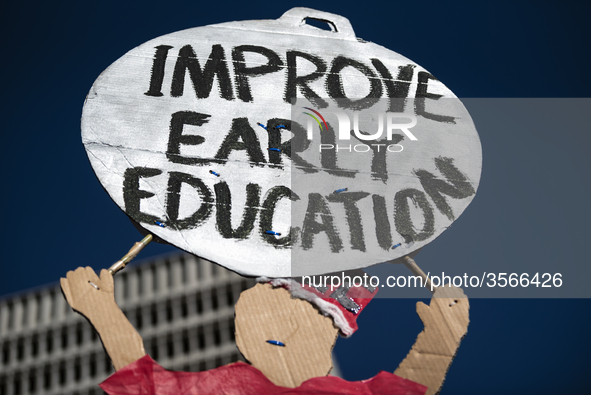 Teachers and supporters of public education march against education funding cuts during the March for Public Education in Los Angeles, Calif...