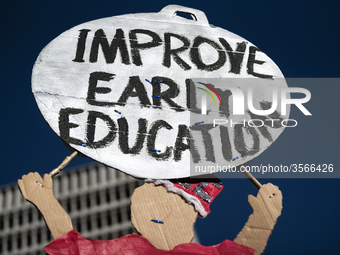 Teachers and supporters of public education march against education funding cuts during the March for Public Education in Los Angeles, Calif...