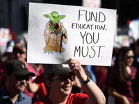 Teachers and supporters of public education march against education funding cuts during the March for Public Education in Los Angeles, Calif...