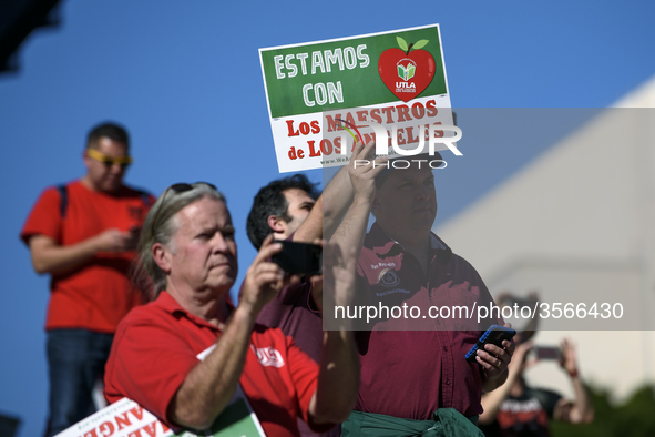 Teachers and supporters of public education march against education funding cuts during the March for Public Education in Los Angeles, Calif...