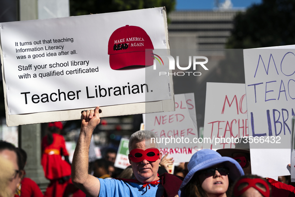 Teachers and supporters of public education march against education funding cuts during the March for Public Education in Los Angeles, Calif...