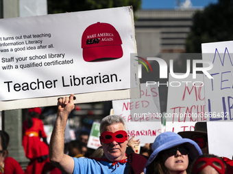 Teachers and supporters of public education march against education funding cuts during the March for Public Education in Los Angeles, Calif...