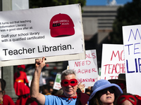 Teachers and supporters of public education march against education funding cuts during the March for Public Education in Los Angeles, Calif...