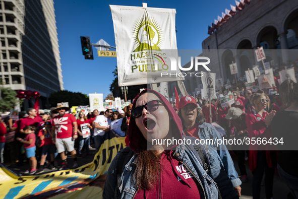 Teachers and supporters of public education march against education funding cuts during the March for Public Education in Los Angeles, Calif...