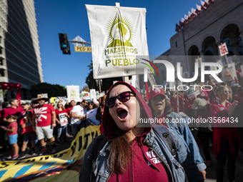 Teachers and supporters of public education march against education funding cuts during the March for Public Education in Los Angeles, Calif...