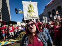 Teachers and supporters of public education march against education funding cuts during the March for Public Education in Los Angeles, Calif...