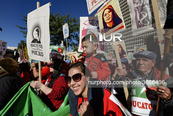 Teachers and supporters of public education march against education funding cuts during the March for Public Education in Los Angeles, Calif...