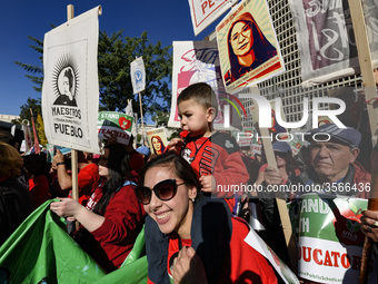 Teachers and supporters of public education march against education funding cuts during the March for Public Education in Los Angeles, Calif...