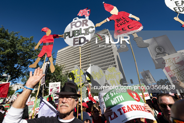 Teachers and supporters of public education march against education funding cuts during the March for Public Education in Los Angeles, Calif...