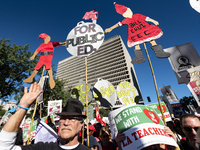 Teachers and supporters of public education march against education funding cuts during the March for Public Education in Los Angeles, Calif...