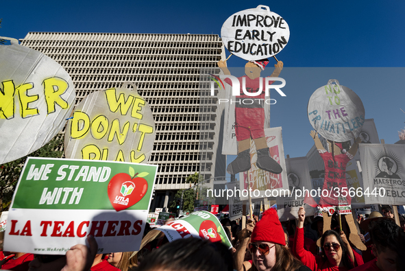 Teachers and supporters of public education march against education funding cuts during the March for Public Education in Los Angeles, Calif...