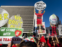 Teachers and supporters of public education march against education funding cuts during the March for Public Education in Los Angeles, Calif...