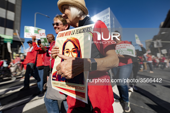 Teachers and supporters of public education march against education funding cuts during the March for Public Education in Los Angeles, Calif...