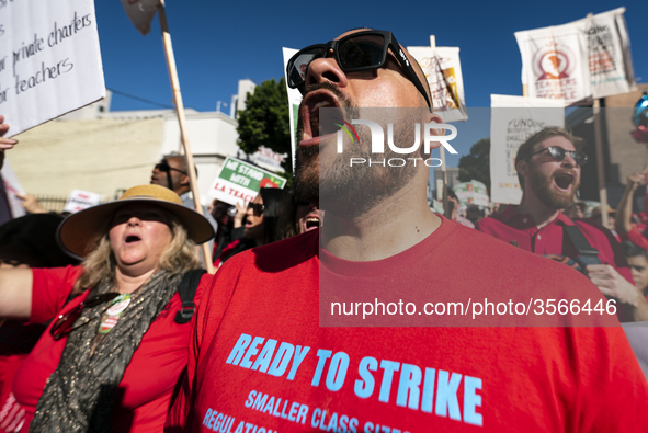 Teachers and supporters of public education march against education funding cuts during the March for Public Education in Los Angeles, Calif...